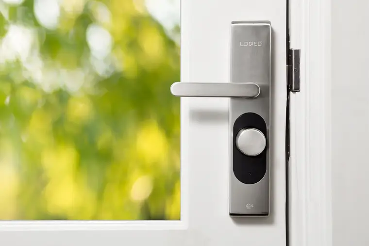 Smart lock on a white door